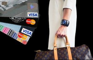 Woman with a Louis Vuitton bag and credit cards.