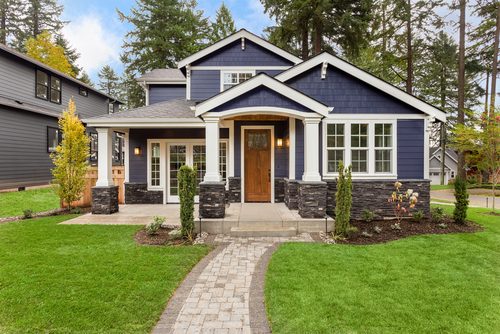 Big blue house with wood door