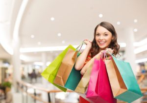 Woman shopping with colorful bags and earning extra income with
