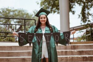 Teen graduating high school