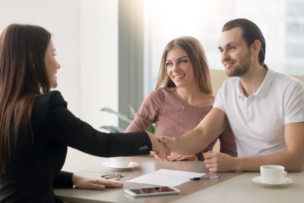 Couple getting a personal loan with a loan officer